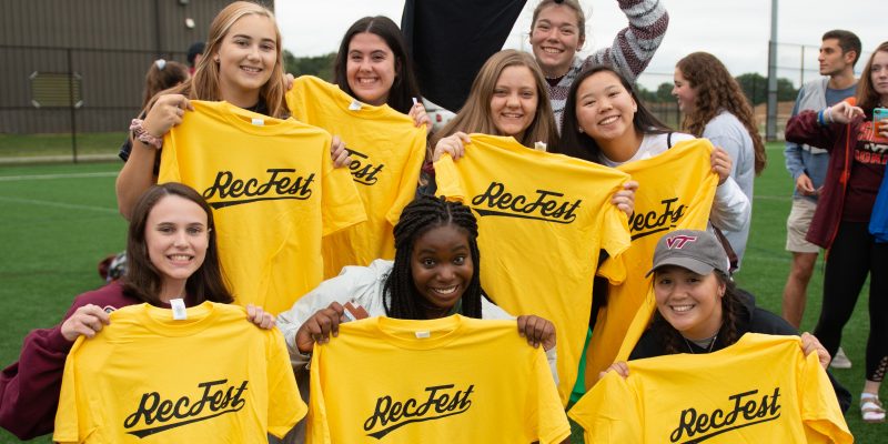 Group of students posing with RecFest tshirts