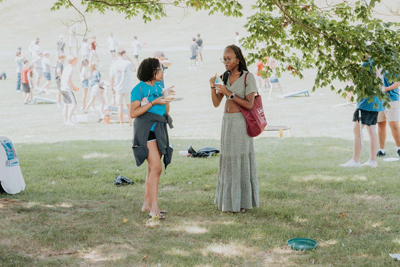 Two students talking with each other at a Recreational Sports Event